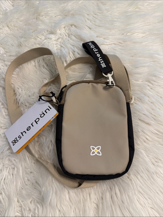 Sherpani Handbags - Sherpani Beige and Black Compact Crossbody Pouch brand new